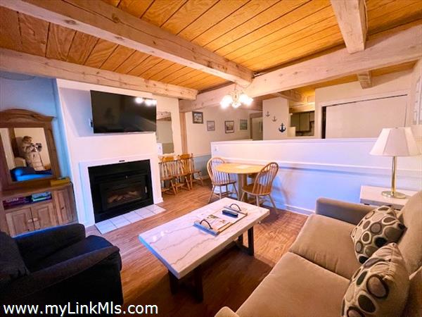 open areas with fireplace in living room for shoulder season living-dining