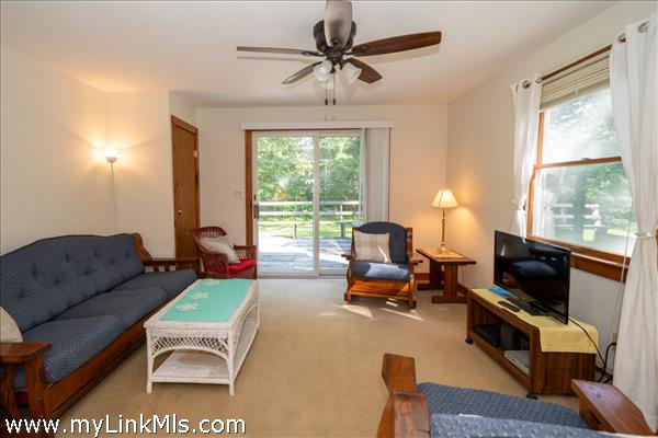 Living room with sliding doors to the back deck