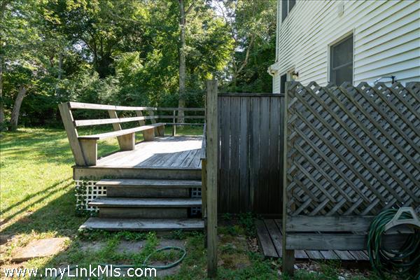 Outdoor shower and back deck off the living room.