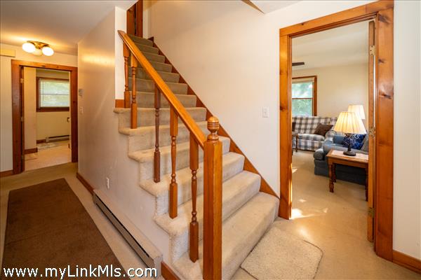Hallway with closet space-looking toward the den