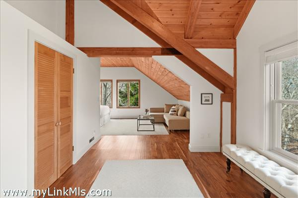 Open room leading to primary suite