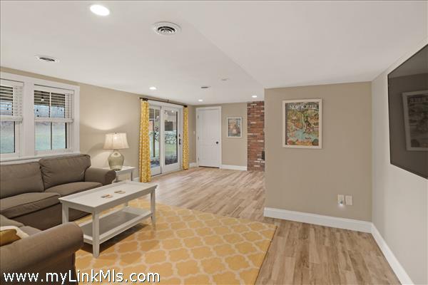 Living area with sliders to backyard