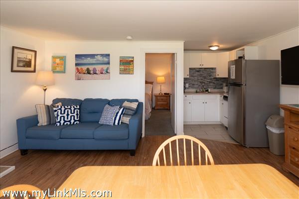 another angle of living space ,bedroom with bathroom through the door