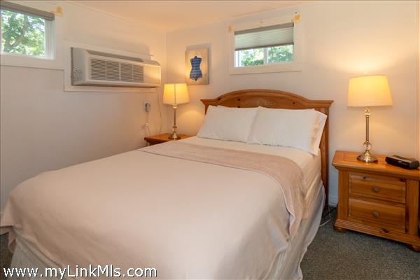 Queen bed  in bedroom, includes bathroom