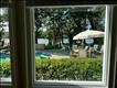 ...enjoys lovely pool and water views