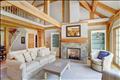 Living Room with fireplace and french doors to back deck