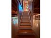 Stairs to the first floor from basement