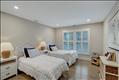 Second floor guest bedroom with en suite bath.