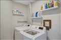 Spacious laundry room with storage.