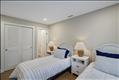 Second floor guest bedroom with en suite bath.