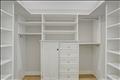 Walk-in closet in the primary bedroom.