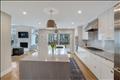 Oversized kitchen island with quartz countertops.