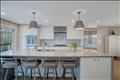 Oversized kitchen island with quartz countertops.