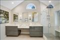 Primary en suite bath is spa-like.