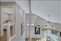 Modern landing overlooking the living room.