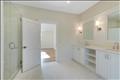 2nd floor primary bathroom with free standing tub, shower stall and private toilet room