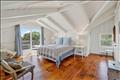 Second floor primary with en suite bath and private deck.