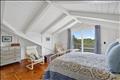Second floor primary with en suite bath and private deck.