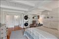 Lower-level bedroom with en suite bath and sliders out to the yard.