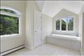 Primary en-suite bath with soaking tub and separate shower