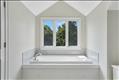 Primary en-suite bath with soaking tub and separate shower
