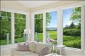 Views from living space out to the Harbor. Photo virtually altered to show seasonality