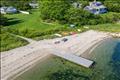Harborfront lot with private sitting area. Photo virtually altered to show seasonality