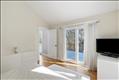 Primary suite to exterior deck.