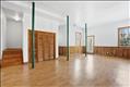 Bright basement with closet and door to the exterior 18 foot ceiling