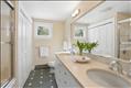 First floor full bath with double sinks and tub/shower, washer/dryer.
