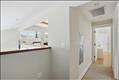 Primary suite with walk-in closet, sitting area, full bath with private access to exterior deck.