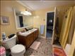 upstairs large bathroom with double vanities opens into both bedrooms up