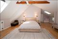 Magnificent master bedroom with vaulted ceilings.