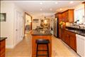 View of the kitchen towards the dining area and family room.