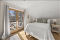 primary bedroom with a private balcony...
