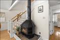 Wood-burning stove adds ambiance to this inviting room