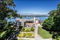 Updated main home has panoramic views and lovely gardens.
