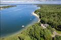 Lagoon waterfront with private beach and views out to Vineyard Sound.