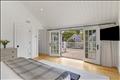 Primary bedroom suite with private balcony