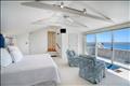 Primary bedroom sanctuary featuring a private sun deck and breathtaking waterviews
