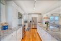 Polished granite countertops complement the custom cabinetry