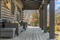 Guest house front porch furnished for relaxation