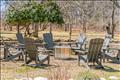 Central firepit and circle of Adirondack chairs for evenings under the stars