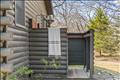 Beautiful copper hardware in custom outdoor shower with changing area