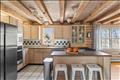 Kitchen with counter seating and stainless appliances