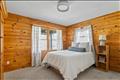 Guest house primary bedroom with ensuite bath