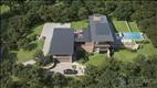 The architectural vision for a house include an infinity pool and landscaping.