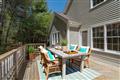 Large deck abutting private wooded area