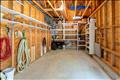 Garage with custom shelving and lots of storage space