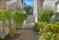 Walkway from driveway to side entrance, outdoor shower and storage shed